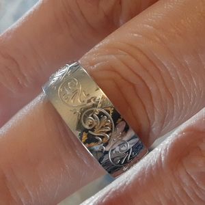 Silver band with vine design